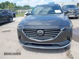 2016 Mazda CX-9 Signature with VIN JM3TCBEY9G0100579, listed as a IAAI auction lot 42282293 with 142,700 mi miles and . Bid and sale history available at DreamBid. Image 12.