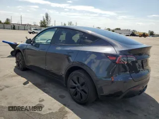 2025 Tesla Model Y Long Range with VIN 7SAYGDED8SF241779, listed as a Copart auction lot 51899205 with 12,409 mi miles and Salvage Title. Bid and sale history available at DreamBid. Image 2.