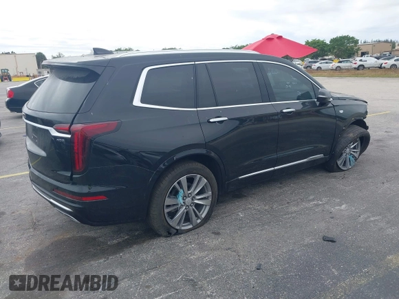 2023 Cadillac XT6 FWD Premium Luxury with VIN 1GYKPCRS6PZ106284, listed as a IAAI auction lot 41595617 with 32,795 mi miles and . Bid and sale history available at DreamBid. Image 4.