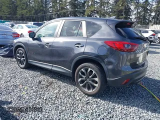 2016 Mazda CX-5 Grand Touring with VIN JM3KE4DY9G0895006, listed as a IAAI auction lot 41703146 with 39,359 mi miles. Bid and sale history available at carsss.com. Image 3.