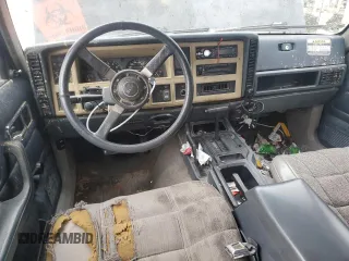 1993 Jeep Cherokee Sport with VIN 1J4FJ68S6PL506709, listed as a Copart auction lot 86638434 with 253,923 mi miles and Salvage Title. Bid and sale history available at carsss.com. Image 8.
