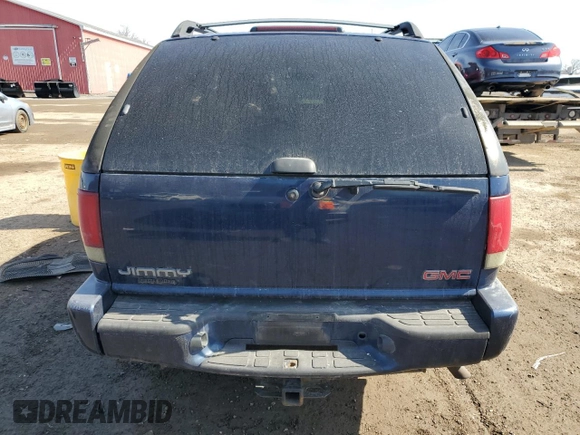 2003 GMC Jimmy z VIN 1GKCT18X43K110056, wystawiony jako Copart lot #48671585 z przebiegiem 272 867 mil mil oraz Czysty tytuł • Clean title. Historia ofert i sprzedaży dostępna na DreamBid. Obrazek 6.