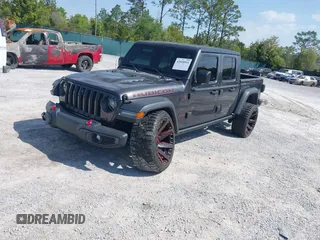 2020 Jeep Gladiator Rubicon with VIN 1C6JJTBG0LL187537, listed as a IAAI auction lot 42018914 with 53,443 mi miles and . Bid and sale history available at DreamBid. Image 18.