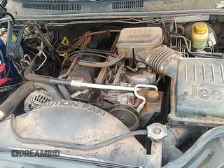 2003 Jeep Grand Cherokee Laredo with VIN 1J4GX48S53C543557, listed as a IAAI auction lot 43123734 with 312,304 mi miles and . Bid and sale history available at DreamBid. Image 12.