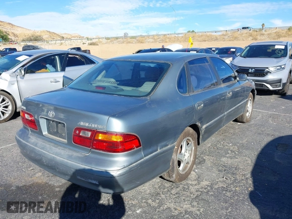 1998 Toyota Avalon XL with VIN 4T1BF18B3WU288614, listed as a IAAI auction lot 40632663 with 185,987 mi miles and . Bid and sale history available at DreamBid. Image 4.