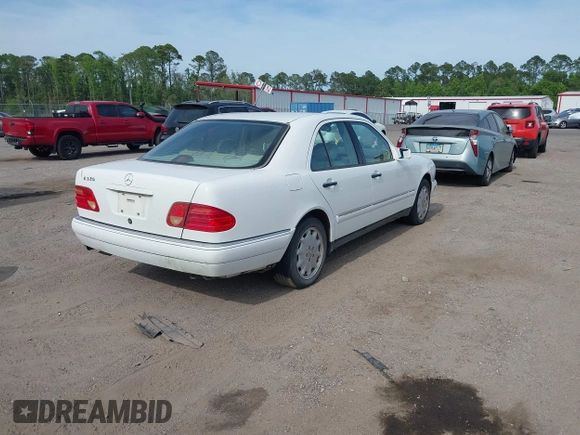 1998 Mercedes-Benz E-Class with VIN WDBJF65FXWA615255, listed as a IAAI auction lot 42146962 with 219,710 mi miles. Bid and sale history available at carsss.com. Image 4.