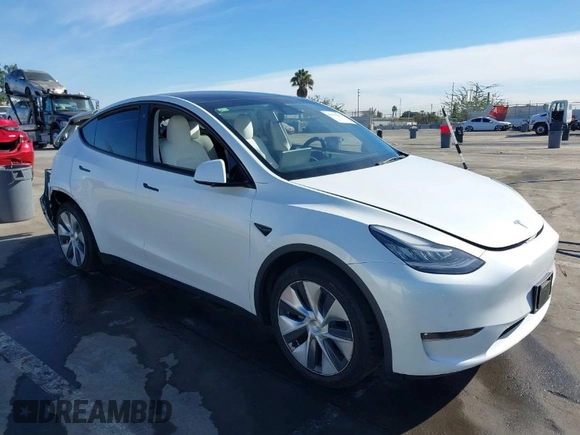 2021 Tesla Model Y Standard Range z VIN 5YJYGDED4MF162982, wystawiony jako IAAI lot #41378674 z przebiegiem 60 267 mil mil oraz . Historia ofert i sprzedaży dostępna na DreamBid. Obrazek 1.