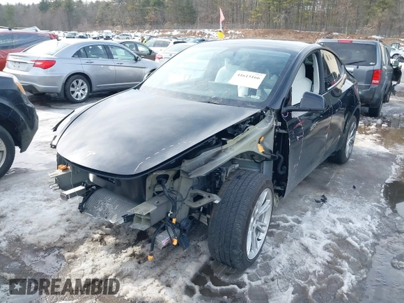 2023 Tesla Model Y Long Range z VIN 7SAYGDEE8PF826989, wystawiony jako IAAI lot #41615166 z przebiegiem 10 368 mil mil oraz . Historia ofert i sprzedaży dostępna na DreamBid. Obrazek 2.