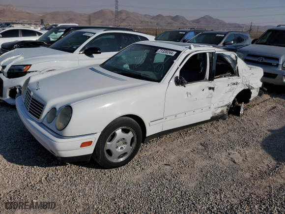1999 Mercedes-Benz E-Class with VIN WDBJF70H5XA831773, listed as a Copart auction lot 71320244 with 145,181 mi miles and Salvage Title. Bid and sale history available at carsss.com. Image 1.