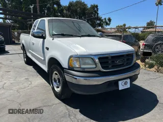2000 Ford F-150 XL with VIN 1FTZX1724YKA94044, listed as a Copart auction lot 66580345 with 201,444 mi miles and Clean title. Bid and sale history available at DreamBid. Image 1.