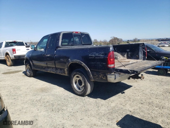 2000 Ford F-150 Work Series with VIN 1FTRX18W0YKB06899, listed as a Copart auction lot 46170175 with 252,042 mi miles and Salvage Title. Bid and sale history available at carsss.com. Image 2.