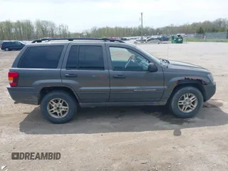2004 Jeep Grand Cherokee Laredo z VIN 1J4GW48S34C399804, wystawiony jako IAAI lot #42163326 z przebiegiem 203 278 mil mil oraz . Historia ofert i sprzedaży dostępna na DreamBid. Obrazek 13.