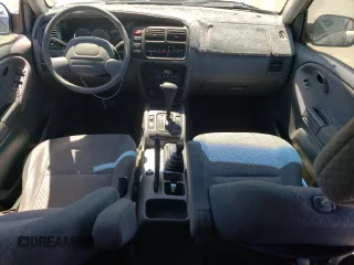 2002 Chevrolet Tracker z VIN 2CNBJ13C026951435, wystawiony jako Copart lot #57782784 z przebiegiem 132 279 mil mil oraz Szkody całkowita. Historia ofert i sprzedaży dostępna na DreamBid. Obrazek 8.