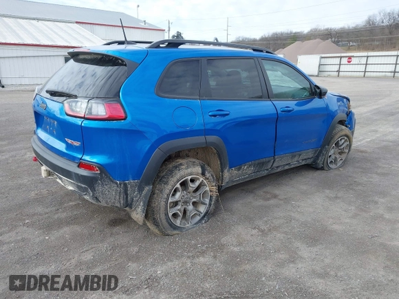 2022 Jeep Cherokee Trailhawk z VIN 1C4PJMBX1ND539319, wystawiony jako IAAI lot #41811178 z przebiegiem 49 922 mil mil oraz . Historia ofert i sprzedaży dostępna na DreamBid. Obrazek 4.