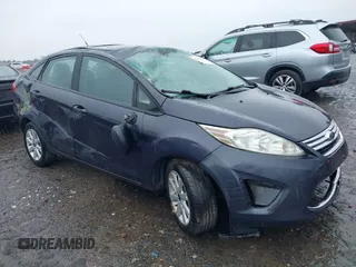 2012 Ford Fiesta SE z VIN 3FADP4BJ4CM155538, wystawiony jako IAAI lot #42352703 z przebiegiem 100 666 mil mil oraz . Historia ofert i sprzedaży dostępna na DreamBid. Obrazek 1.