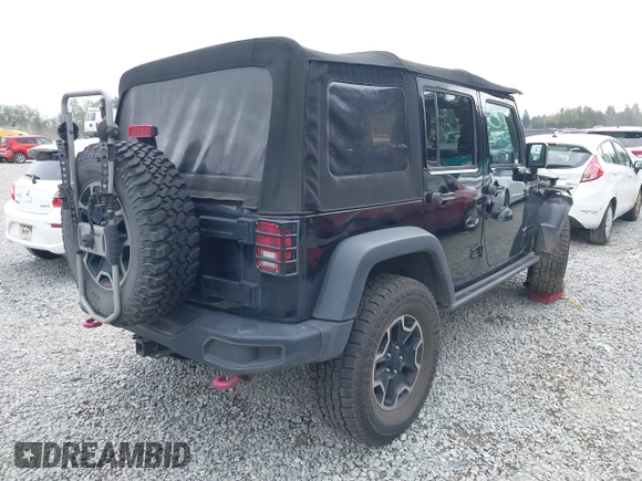 2015 Jeep Wrangler Unlimited Rubicon Hard Rock with VIN 1C4HJWFG6FL757421, listed as a IAAI auction lot 42107514 with 63,997 mi miles and . Bid and sale history available at DreamBid. Image 4.
