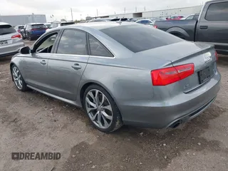 2013 Audi A6 3.0T Prestige with VIN WAUHGAFC3DN131239, listed as a IAAI auction lot 41168869 with 134,628 mi miles. Bid and sale history available at carsss.com. Image 3.