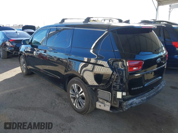 2021 Kia Sedona EX with VIN KNDMC5C10M6671729, listed as a IAAI auction lot 40858206 with 58,775 mi miles. Bid and sale history available at carsss.com. Image 3.