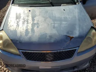 2006 Suzuki Aerio Premium z VIN JS2RA62S665301623, wystawiony jako Copart lot #77708054 z przebiegiem 189 464 mil mil oraz Szkoda całkowita • Salvage title. Historia ofert i sprzedaży dostępna na DreamBid. Obrazek 13.