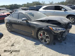 2020 Kia Stinger GT with VIN KNAE35LC8L6072093, listed as a Copart auction lot 77596574 with 77,347 mi miles and Salvage Title. Bid and sale history available at DreamBid. Image 4.