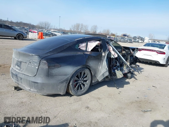 2016 Tesla Model S 90D with VIN 5YJSA1E42GF143731, listed as a IAAI auction lot 41394839 with Not provided miles and . Bid and sale history available at DreamBid. Image 4.