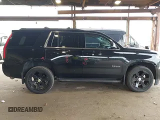 2015 Chevrolet Tahoe LT with VIN 1GNSKBKCXFR604401, listed as a IAAI auction lot 42048559 with 60,768 mi miles and . Bid and sale history available at DreamBid. Image 13.