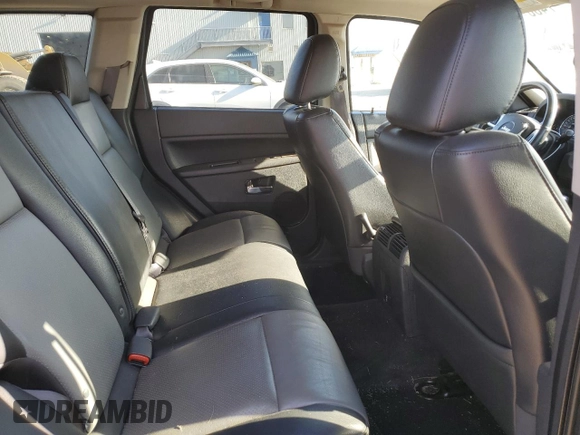 2009 Jeep Grand Cherokee Laredo with VIN 1J8HR48P39C559192, listed as a Copart auction lot 74007094 with 105,997 mi miles and Salvage Title. Bid and sale history available at carsss.com. Image 10.