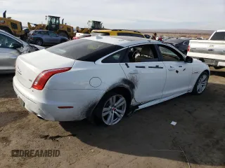 2014 Jaguar XJ with VIN SAJWA2GZ7E8V69543, listed as a Copart auction lot 86390204 with 110,929 mi miles and Salvage Title. Bid and sale history available at carsss.com. Image 3.