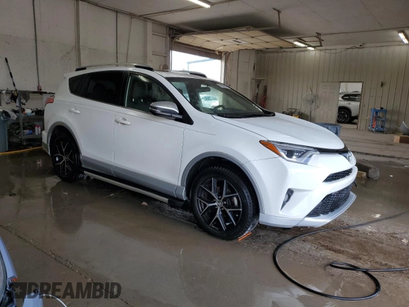 2016 Toyota RAV4 SE with VIN JTMJFREV0GD190302, listed as a Copart auction lot 59330345 with 102,069 mi miles and Salvage title. Bid and sale history available at DreamBid. Image 4.