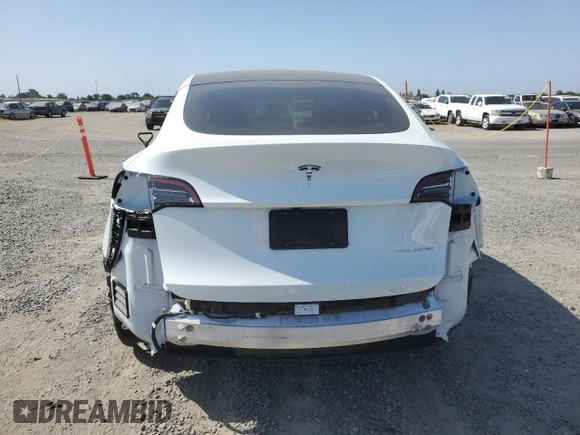 2024 Tesla Model Y Long Range with VIN 7SAYGAEE2RF103110, listed as a Copart auction lot 59422975 with 13,572 mi miles and Salvage title. Bid and sale history available at DreamBid. Image 6.