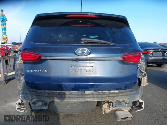 2019 Hyundai Santa Fe SE z VIN 5NMS23AD8KH096209, wystawiony jako IAAI lot #42235035 z przebiegiem 76 543 mil mil oraz . Historia ofert i sprzedaży dostępna na DreamBid. Obrazek 17.