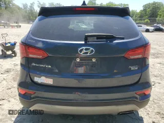 2017 Hyundai Santa Fe 2.4L z VIN 5NMZUDLB7HH028678, wystawiony jako Copart lot #57557855 z przebiegiem 102 049 mil mil oraz Szkoda całkowita • Salvage title. Historia ofert i sprzedaży dostępna na DreamBid. Obrazek 6.