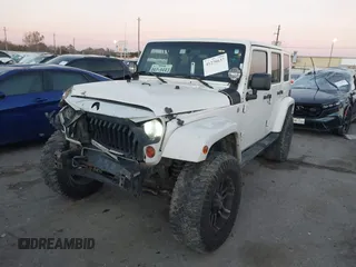 2010 Jeep Wrangler Unlimited Sahara with VIN 1J4BA5H15AL184376, listed as a IAAI auction lot 41270637 with 143,339 mi miles. Bid and sale history available at carsss.com. Image 17.