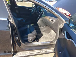 2016 Tesla Model S 90D with VIN 5YJSA1E22GF174301, listed as a IAAI auction lot 38867108 with 60,715 mi miles and . Bid and sale history available at DreamBid. Image 5.