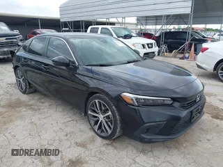 2022 Honda Civic Touring with VIN 2HGFE1F9XNH321586, listed as a IAAI auction lot 42373958 with 21,551 mi miles and . Bid and sale history available at DreamBid. Image 1.