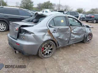 2014 Mitsubishi Lancer Evolution MR with VIN JA32W5FV7EU008165, listed as a IAAI auction lot 41553978 with 49,284 mi miles. Bid and sale history available at carsss.com. Image 4.