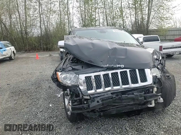 2013 Jeep Grand Cherokee Overland with VIN 1C4RJFCGXDC643802, listed as a Copart auction lot 52429535 with 122,014 mi miles and Salvage Title. Bid and sale history available at carsss.com. Image 11.
