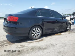 2014 Volkswagen Jetta SE z VIN 3VWD07AJ4EM445862, wystawiony jako Copart lot #61411995 z przebiegiem Nie podano mil oraz Czysty tytuł • Clean title. Historia ofert i sprzedaży dostępna na DreamBid. Obrazek 3.