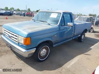 1990 Ford 1/2 Ton Trucks with VIN 1FTDF15N1LPA17475, listed as a IAAI auction lot 42045890 with 5,891 mi miles. Bid and sale history available at carsss.com. Image 2.