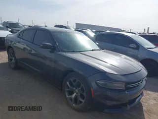 2015 Dodge Charger SXT with VIN 2C3CDXHG4FH890684, listed as a IAAI auction lot 41896958 with 118,140 mi miles and . Bid and sale history available at DreamBid. Image 1.