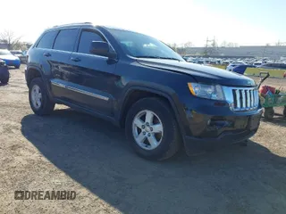 2012 Jeep Grand Cherokee Laredo with VIN 1C4RJFAG5CC118826, listed as a IAAI auction lot 42039801 with 158,153 mi miles. Bid and sale history available at carsss.com. Image 1.