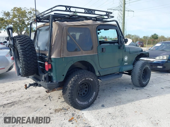 2000 Jeep Wrangler Sahara with VIN 1J4FA59SXYP743190, listed as a IAAI auction lot 41699142 with 1 mi miles. Bid and sale history available at carsss.com. Image 4.