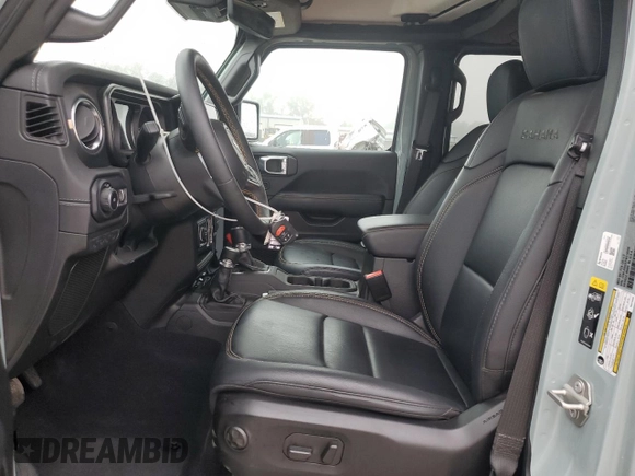 2024 Jeep Wrangler Sahara with VIN 1C4PJXEGXRW210206, listed as a Copart auction lot 58059115 with 14,492 mi miles and Salvage title. Bid and sale history available at DreamBid. Image 7.