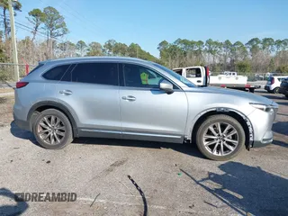 2017 Mazda CX-9 Grand Touring with VIN JM3TCADY5H0138176, listed as a IAAI auction lot 41458610 with 114,664 mi miles and . Bid and sale history available at DreamBid. Image 13.