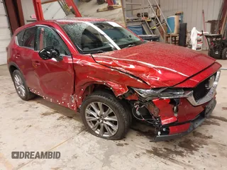 2019 Mazda CX-5 Grand Touring with VIN JM3KFBDM0K1586364, listed as a IAAI auction lot 42332935 with 61,263 mi miles and . Bid and sale history available at DreamBid. Image 1.