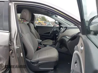 2016 Hyundai Santa Fe z VIN 5XYZTDLB1GG343763, wystawiony jako IAAI lot #41659641 z przebiegiem 96 415 mil mil oraz . Historia ofert i sprzedaży dostępna na DreamBid. Obrazek 5.
