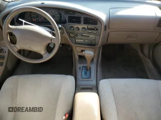 1995 Toyota Camry LE with VIN JT2GK12E7S0107467, listed as a Copart auction lot 83491534 with 112,971 mi miles and Salvage Title. Bid and sale history available at carsss.com. Image 8.