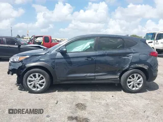 2021 Hyundai Tucson SE with VIN KM8J23A41MU291085, listed as a IAAI auction lot 41956974 with 93,932 mi miles. Bid and sale history available at carsss.com. Image 14.