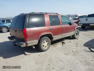 1999 Chevrolet Tahoe with VIN 1GNEC13R9XJ341261, listed as a IAAI auction lot 41741710 with 234,676 mi miles. Bid and sale history available at carsss.com. Image 4.