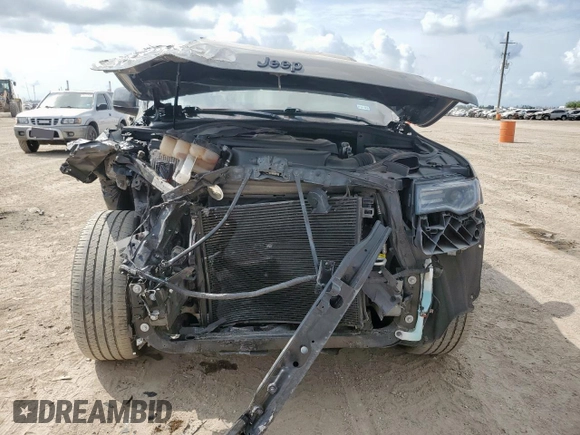 2022 Jeep Grand Cherokee Laredo X with VIN 1C4RJFAGXNC146723, listed as a Copart auction lot 58119455 with 55,759 mi miles and Salvage title. Bid and sale history available at DreamBid. Image 5.